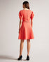 HAYLIY-Dresses-Feminine, flattering and a wardrobe staple, HAYLIY is ideal for day-to-night dressing. Cut with short puff sleeves, a square neckline and a zip fastening, this dress will be your go-to piece for bar-hopping and date nights.This product is made using FSC ® Viscose fibres. The fabric of this product is partly made of a more sustainable viscose fibre, which comes from responsibly managed forests. Skater dress Short puff sleeves Square neck Zip fastening Elasticated waistband Julia is 5'10" / 1.7